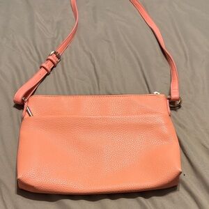 Super cute salmon/peach “a new day” purse with long shoulder strap